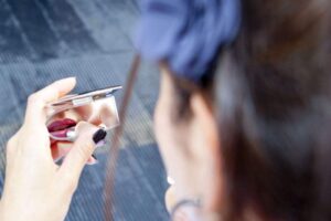 Bride applying Lipstick wedding photography from Jonathan Lappin Lincoln